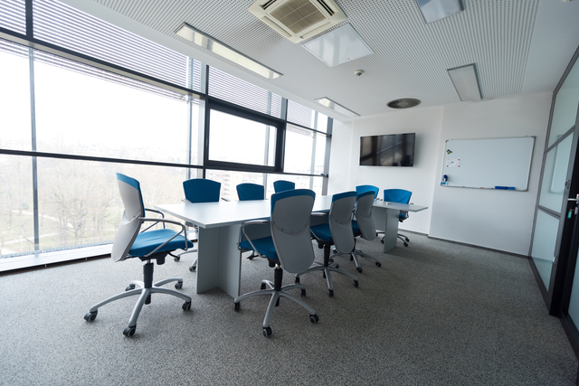interior of new modern office meeting room with big windows